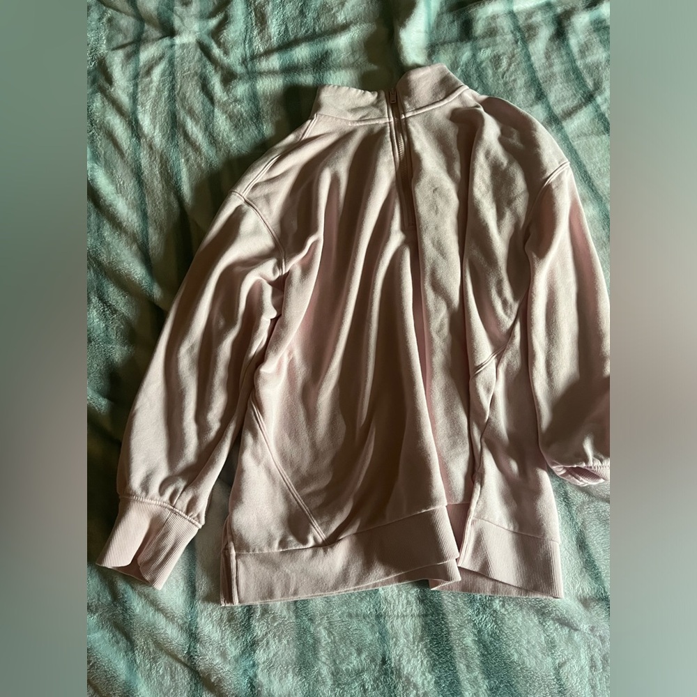 woman’s pink quarter zip